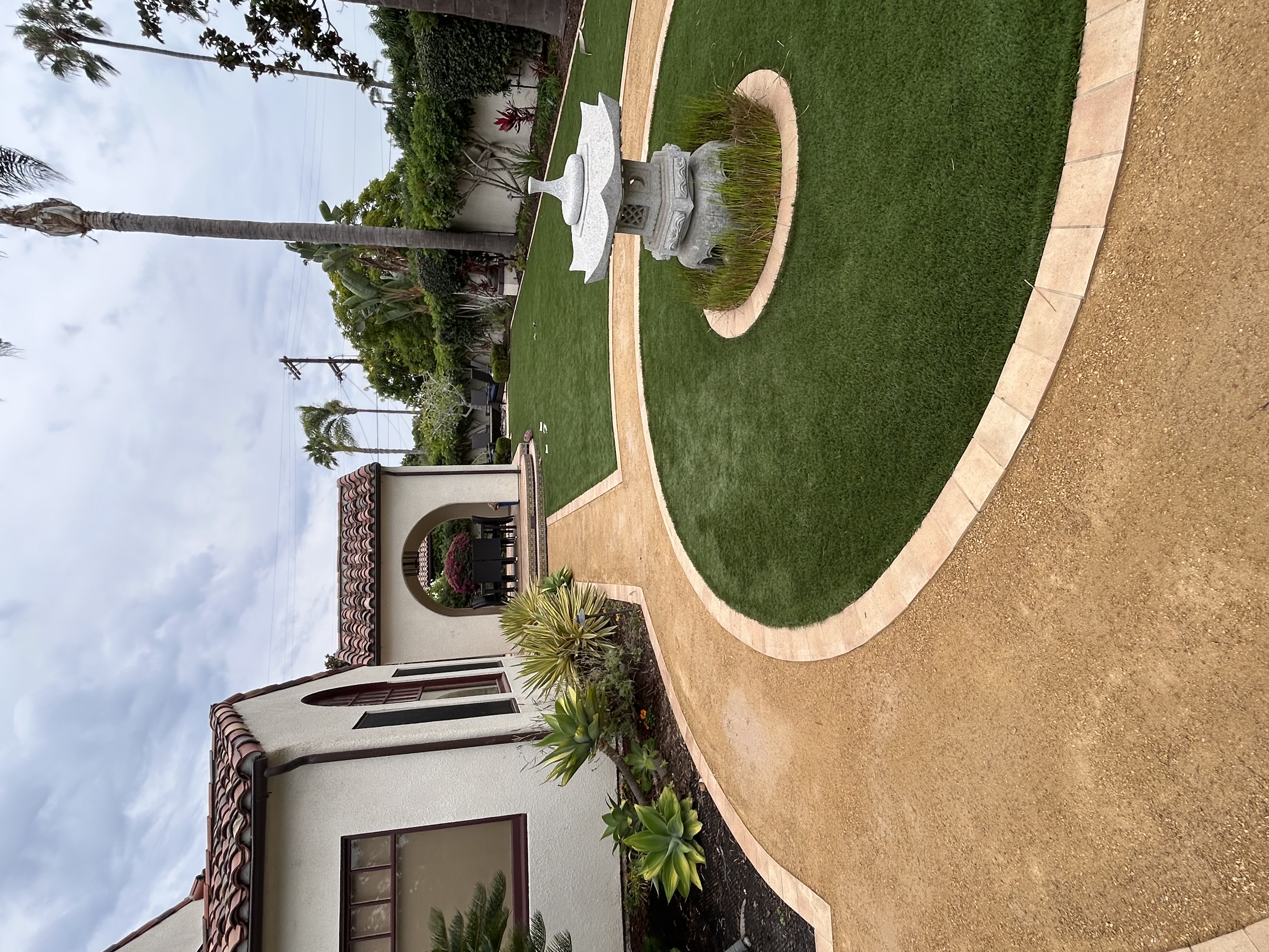 Luxury backyard pool design with paver surround