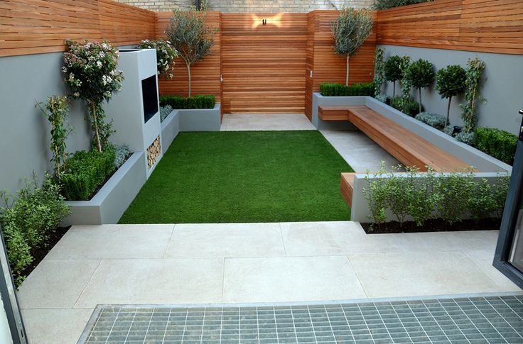 Low-maintenance turf and backyard landscaping with pavers