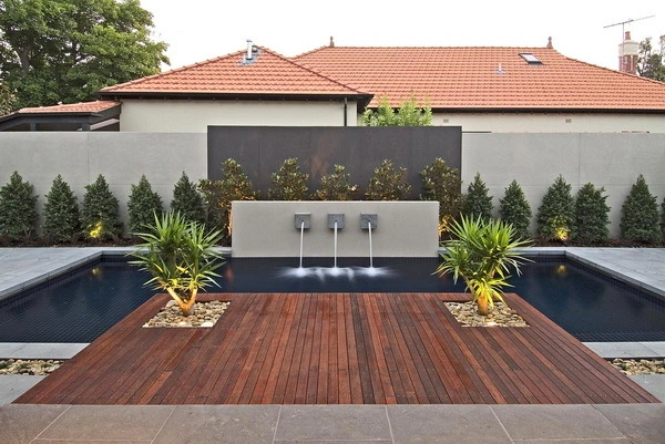 Backyard pool with paver patio and seating area
