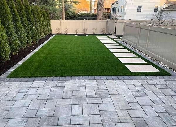 Modern poolside hardscaping with stone coping